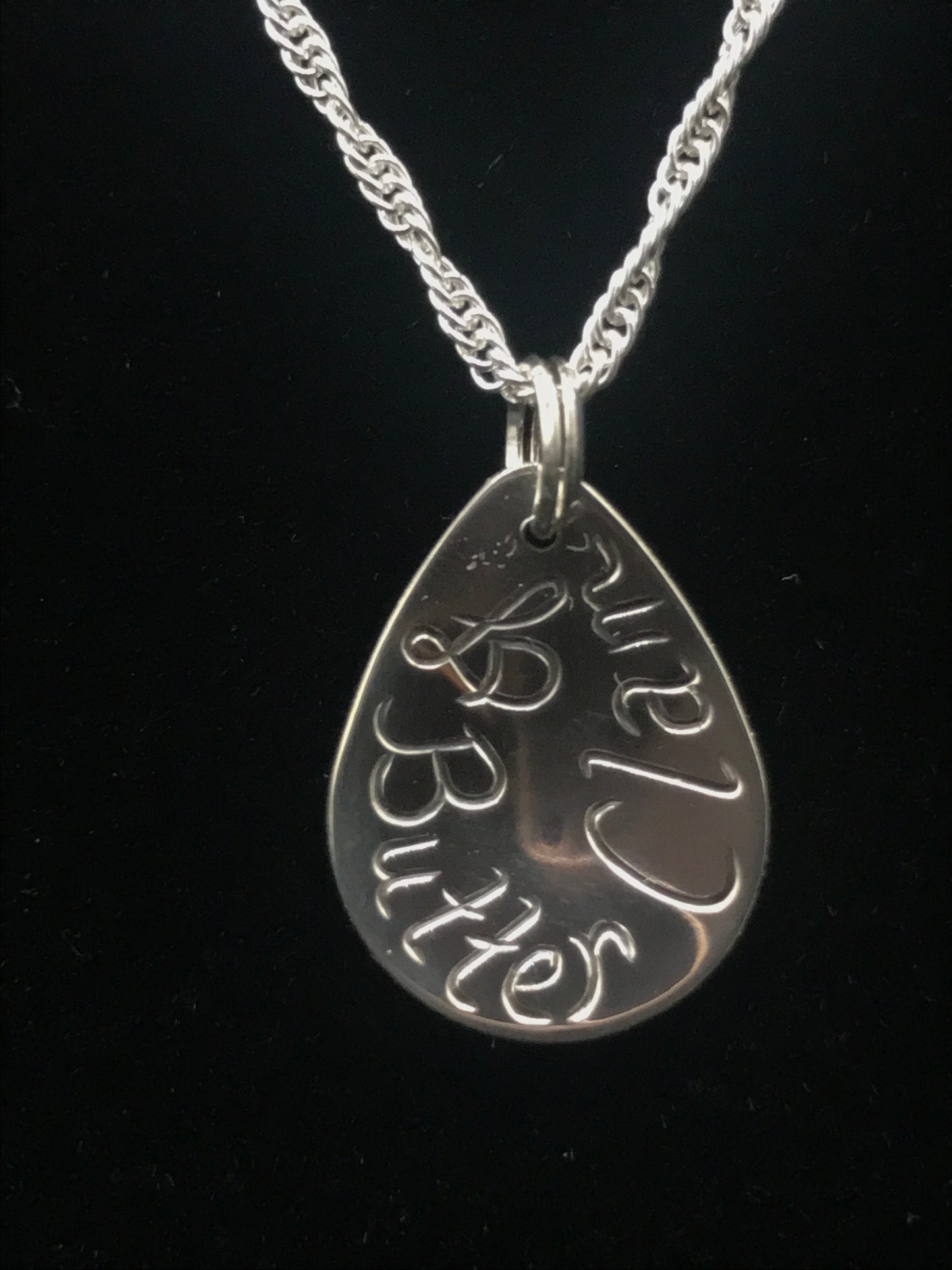 Back of Butter Clam sterling silver drop pendant by Laura Dutheil.