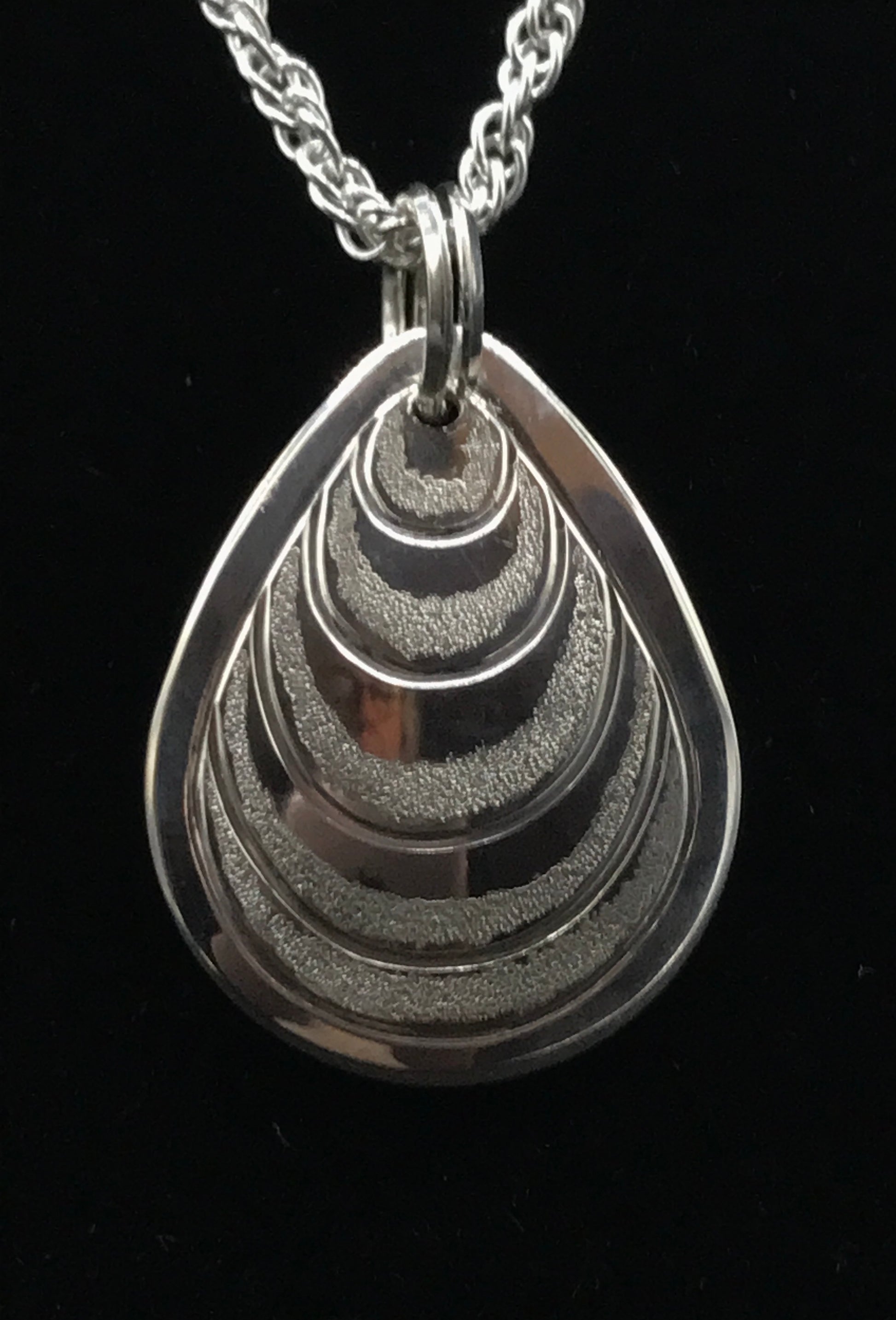 Butter Clam sterling silver drop by Laura Dutheil.