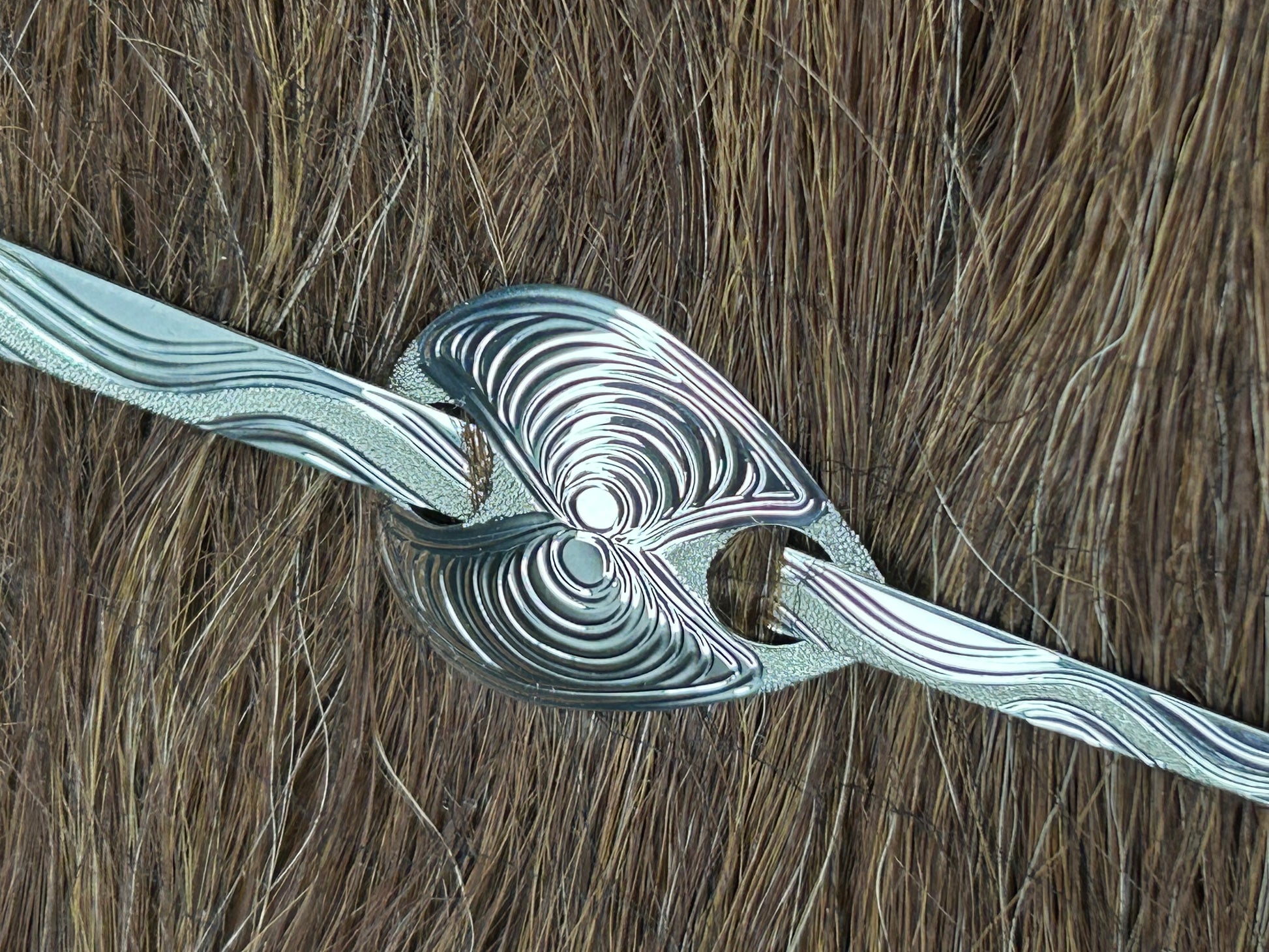 Butter clam sterling silver hair jewelley displayed on hair model .
Hand crafted by Laura Dutheil.