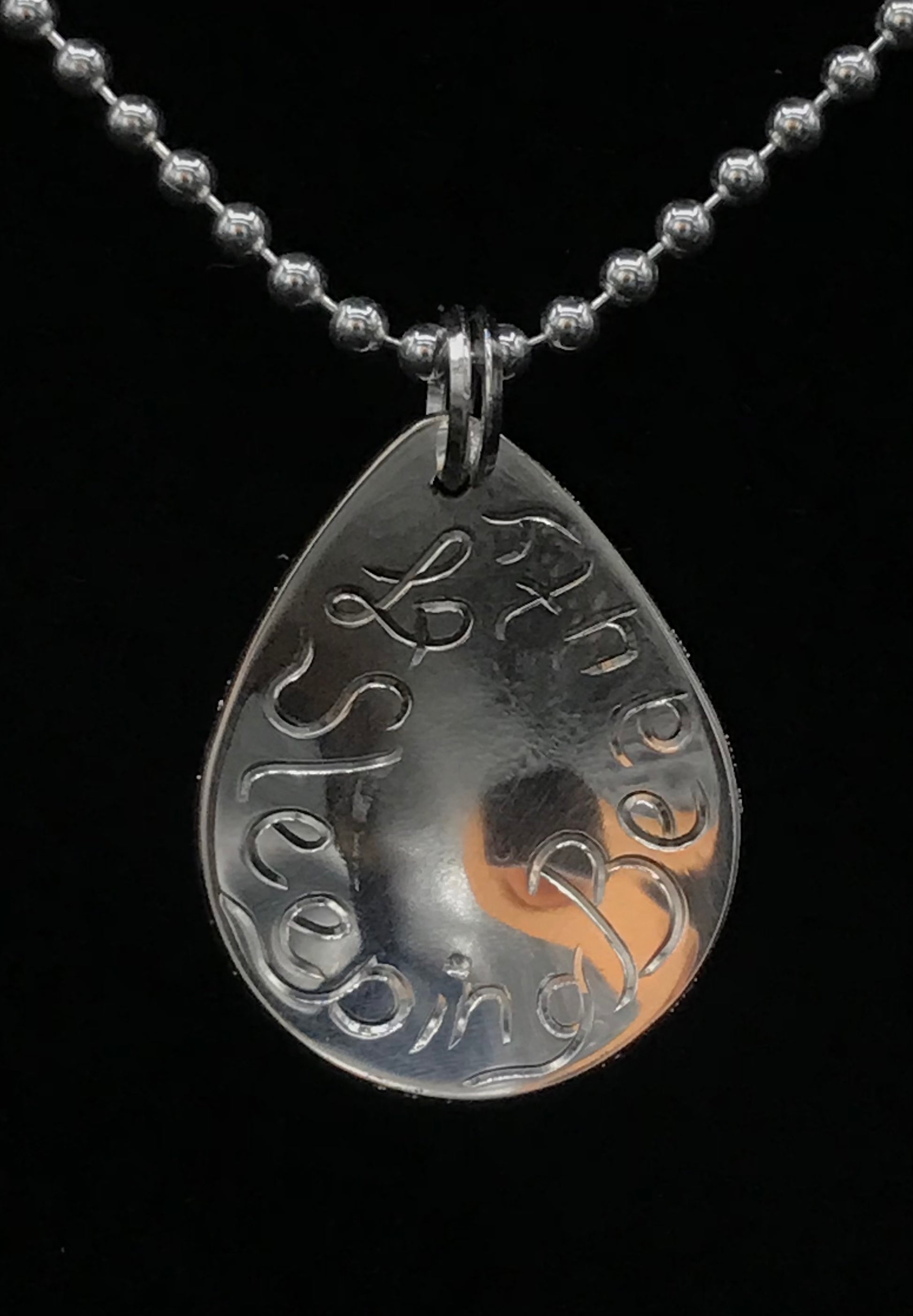 Back of Sleeping Beauty sterling silver pendant .