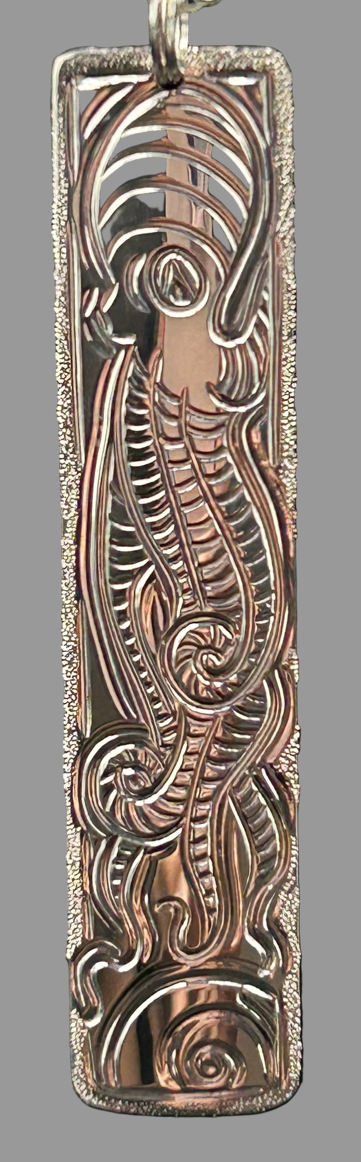 Octopus and  Moon Snail sterling silver pendant with beach crab on the back designed and engraved by Laura Dutheil.