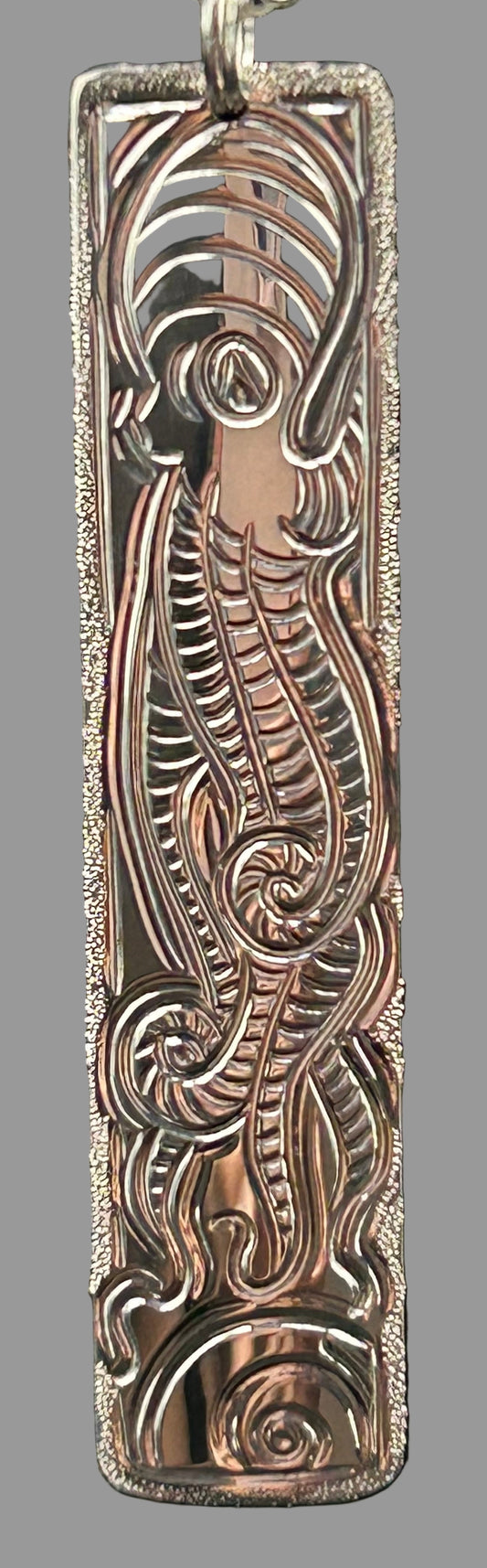 Octopus and  Moon Snail sterling silver pendant with beach crab on the back designed and engraved by Laura Dutheil.