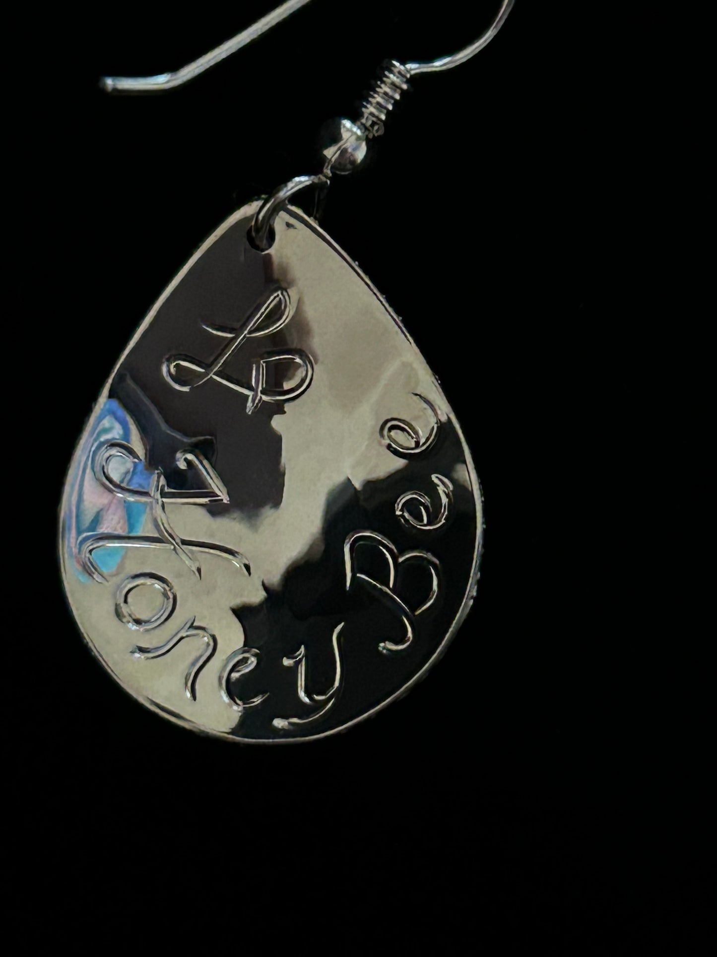 Honey Bee and artist's initials engraved on back of earring. 