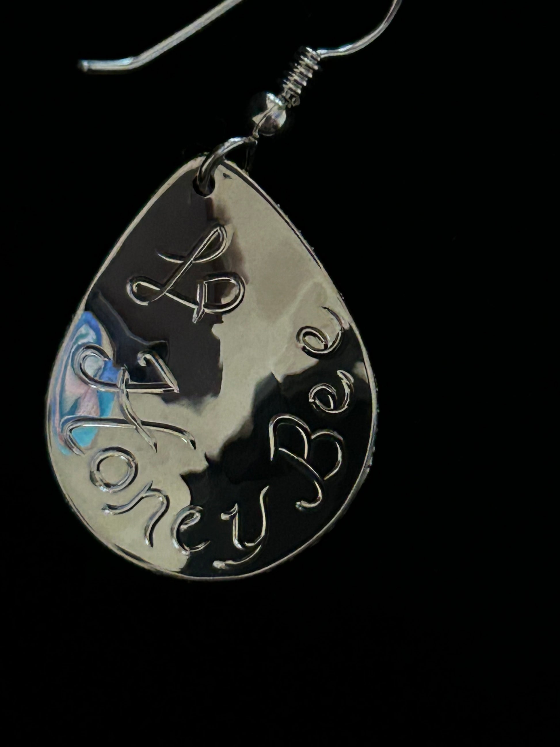 Honey Bee and artist's initials engraved on back of earring. 