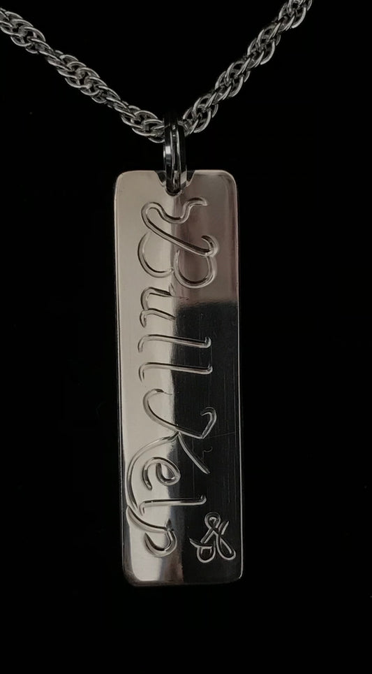 Back of Bull Kelp tag style pendant by Laura Dutheil .