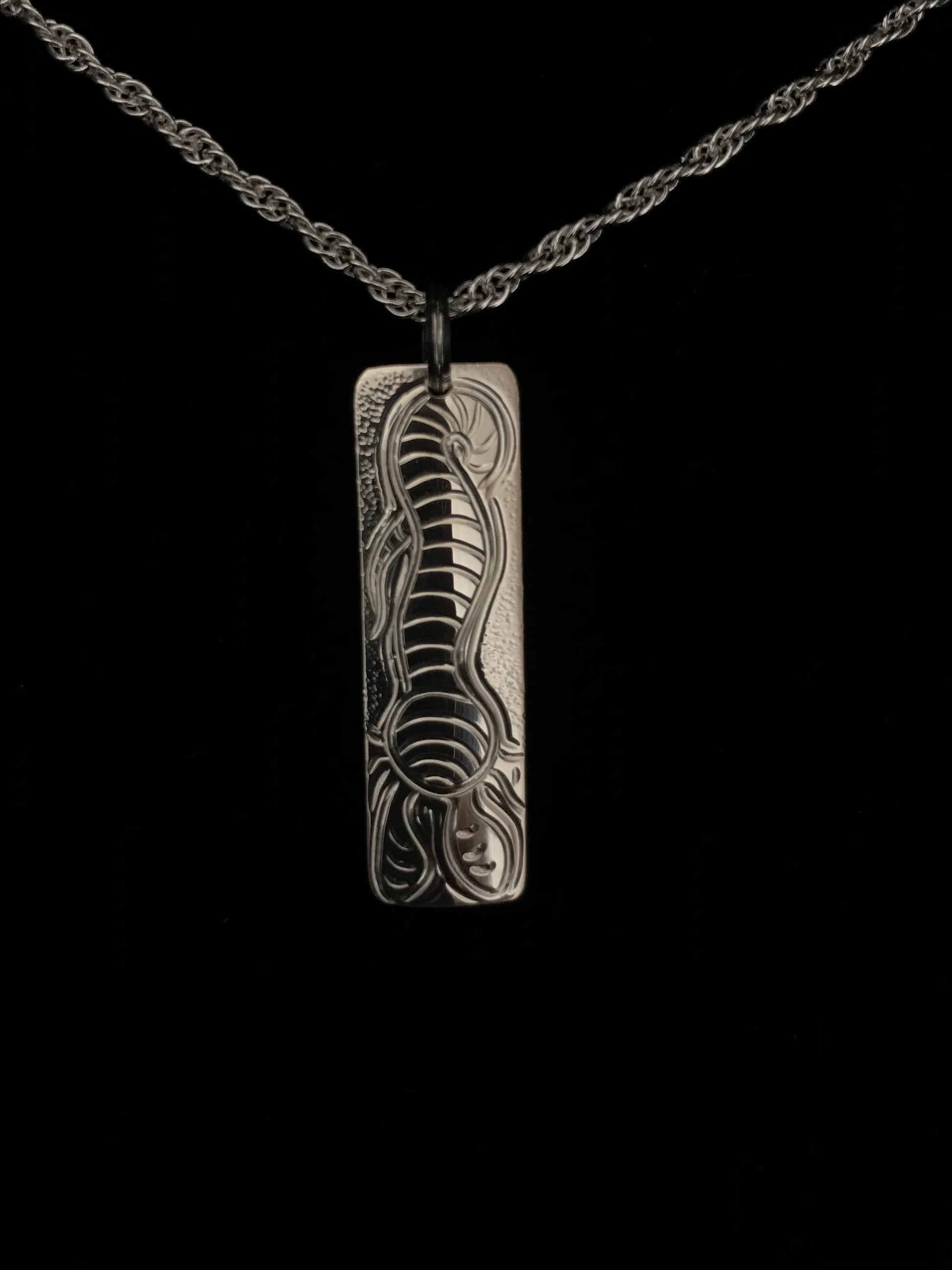 Bull Kelp sterling silver tag style pendant designed and engraved by island artisan jeweller Laura Dutheil.