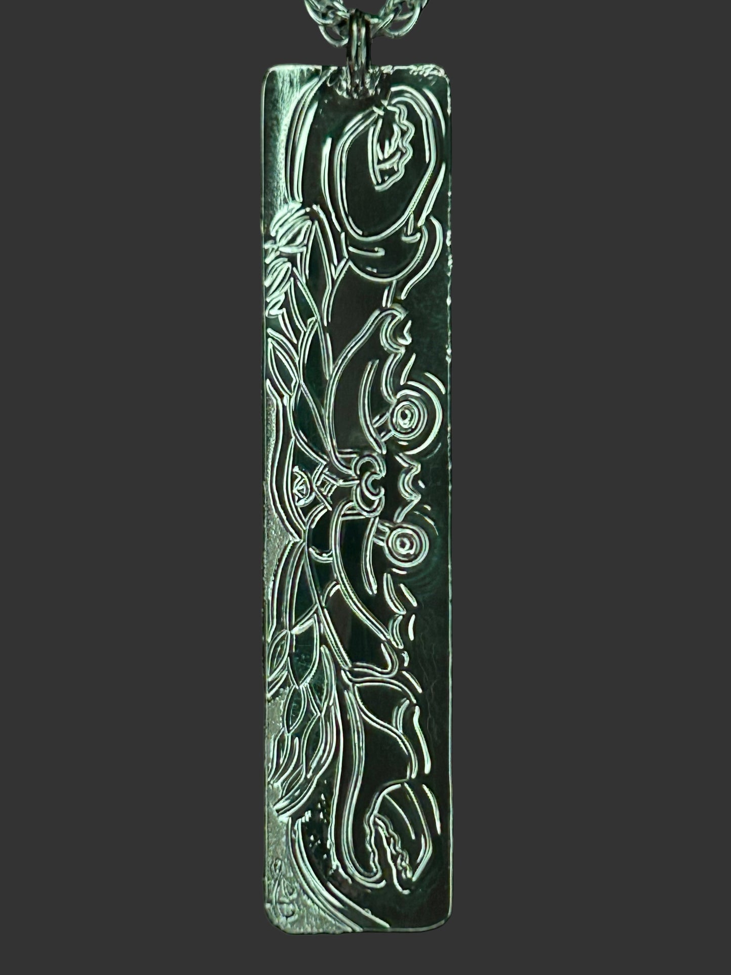 Crab on the beach engraved on back of the Octopus /Moon Snail sterling silver pendant. Designed and engraved by Laura Dutheil.