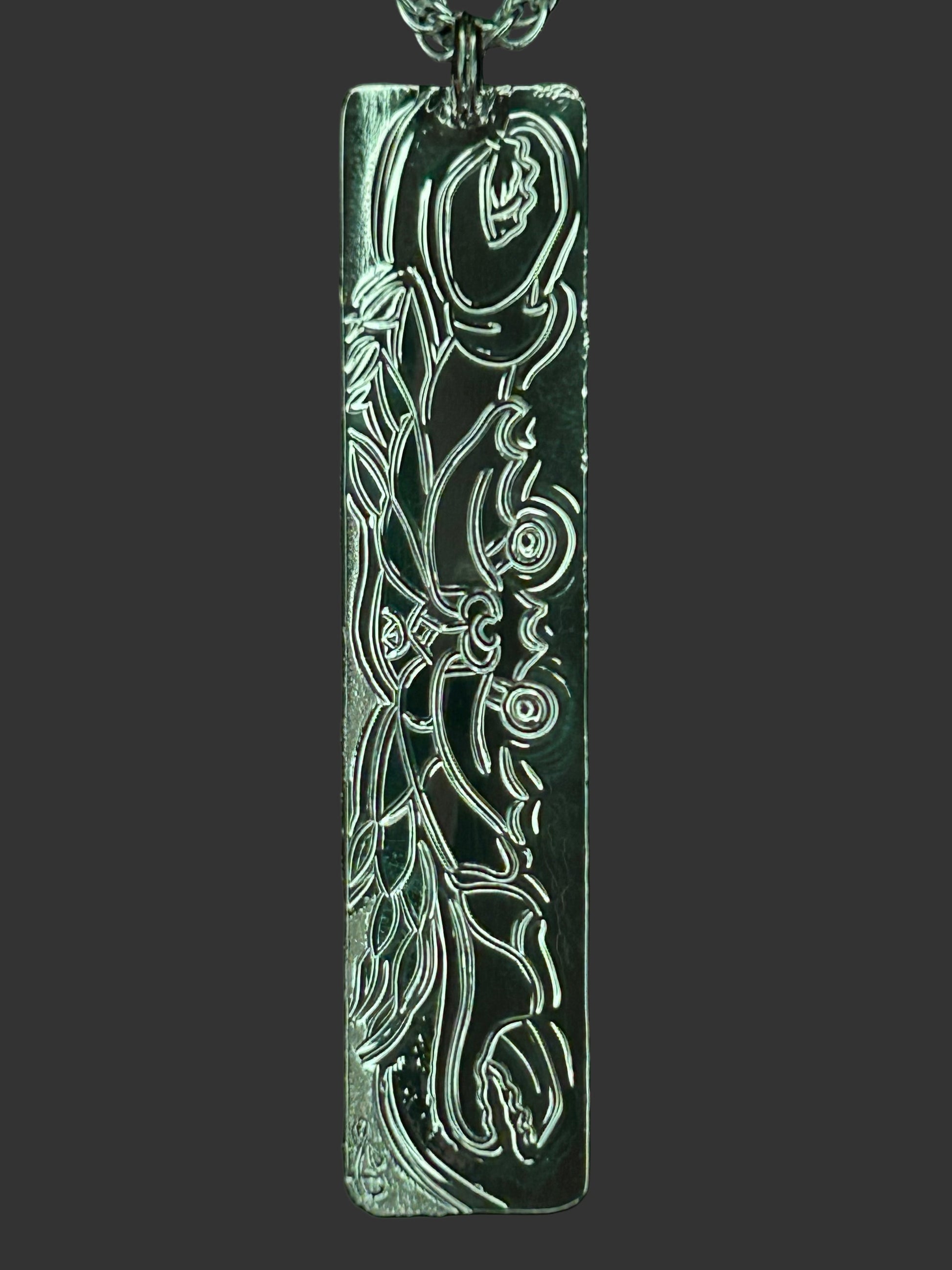 Crab on the beach engraved on back of the Octopus /Moon Snail sterling silver pendant. Designed and engraved by Laura Dutheil.