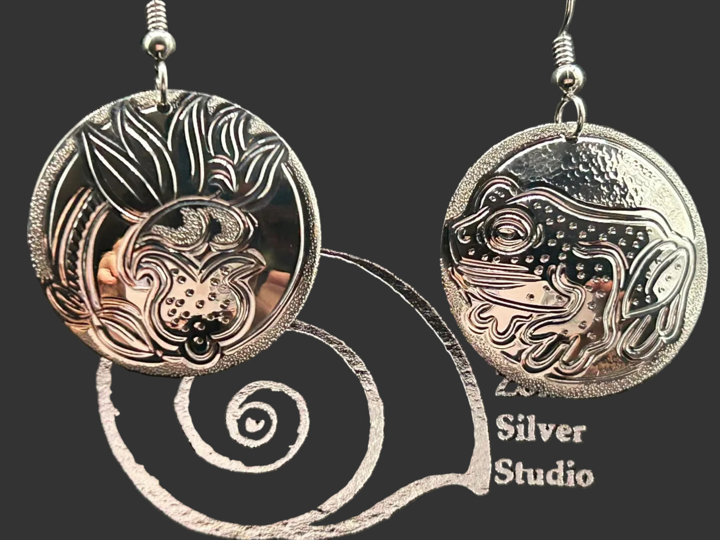Lady slipper and tree frog sterling silver 1 inch round earrings by Laura Dutheil. Two images of protected species of Haida Gwaii forest.