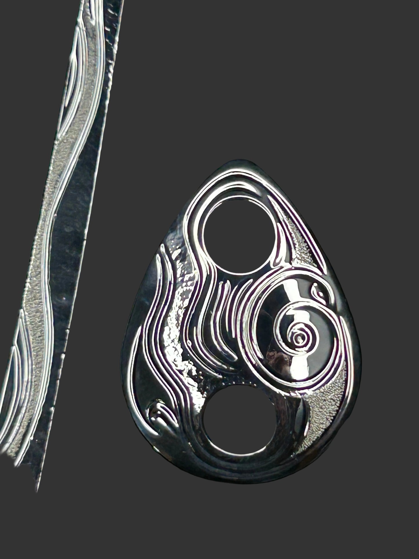 Moon Snail sterling silver hair jewellery designed and engraved by island artisan jeweller Laura Dutheil.
