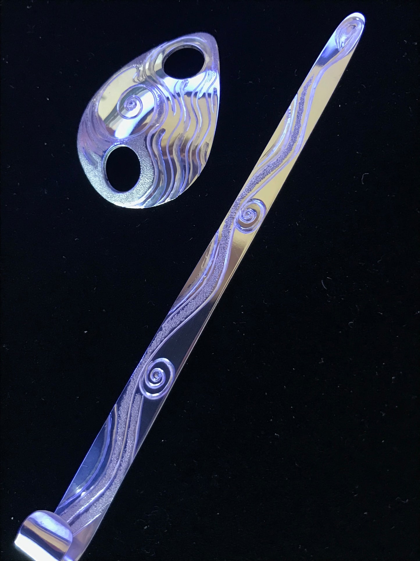 Moon Snail sterling silver hairpiece for ornamental wear in hair designed and engraved by island artisan jeweller Laura Dutheil.