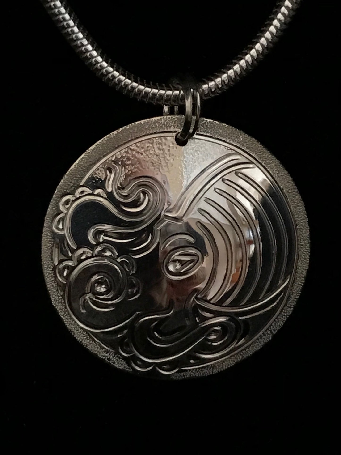 Octopus sterling silver pendant by island artisan jeweller Laura Dutheil.