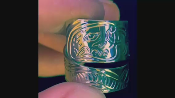 Sea Otter with Urchin and Bull Kelp seaweed large wrap sterling silver ring designed and engraved by island artisan jeweller Laura Dutheil .